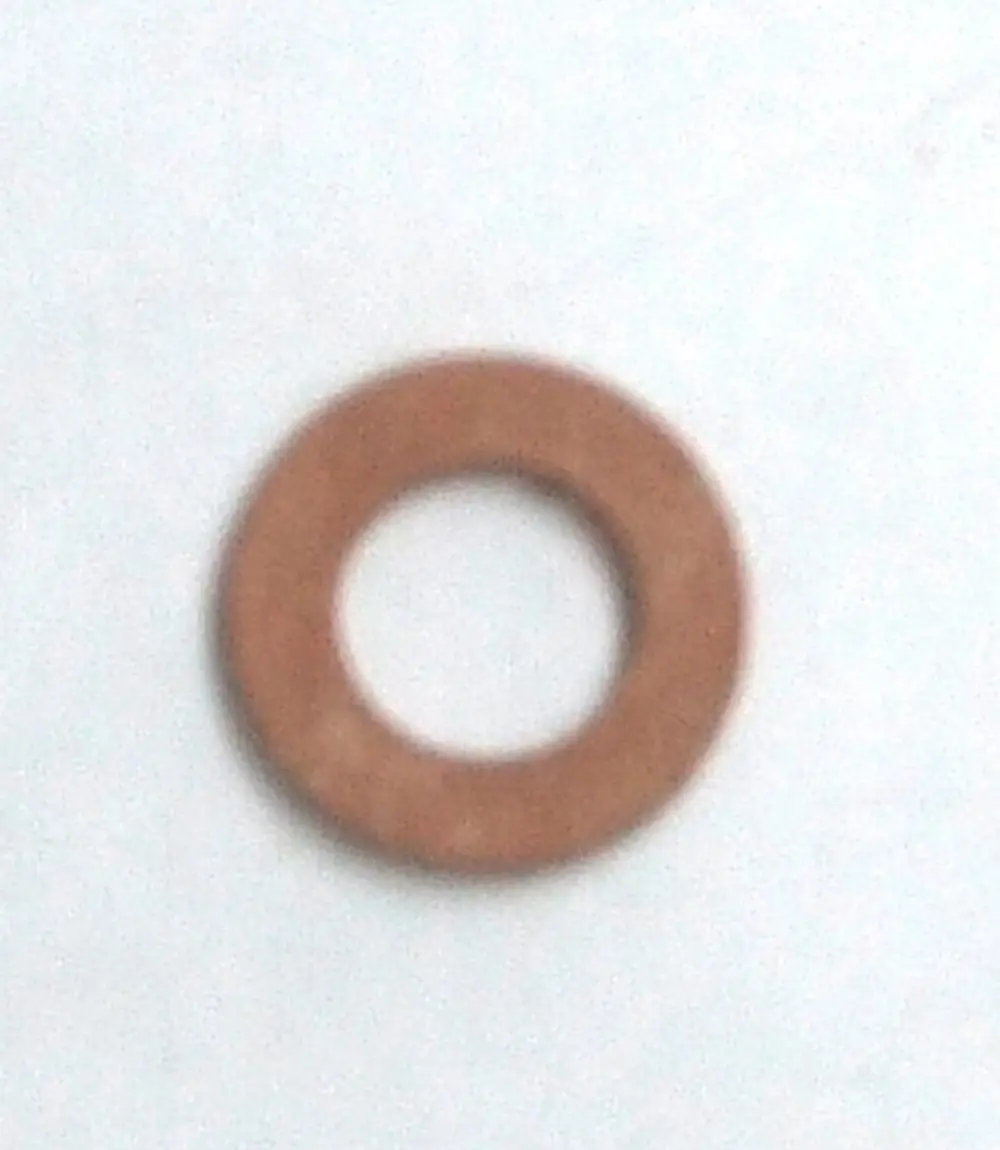 Dichtung in runder Form von Daikin, aus flexiblem Material, mit einem mittleren Loch, auf einem hellen Hintergrund platziert.